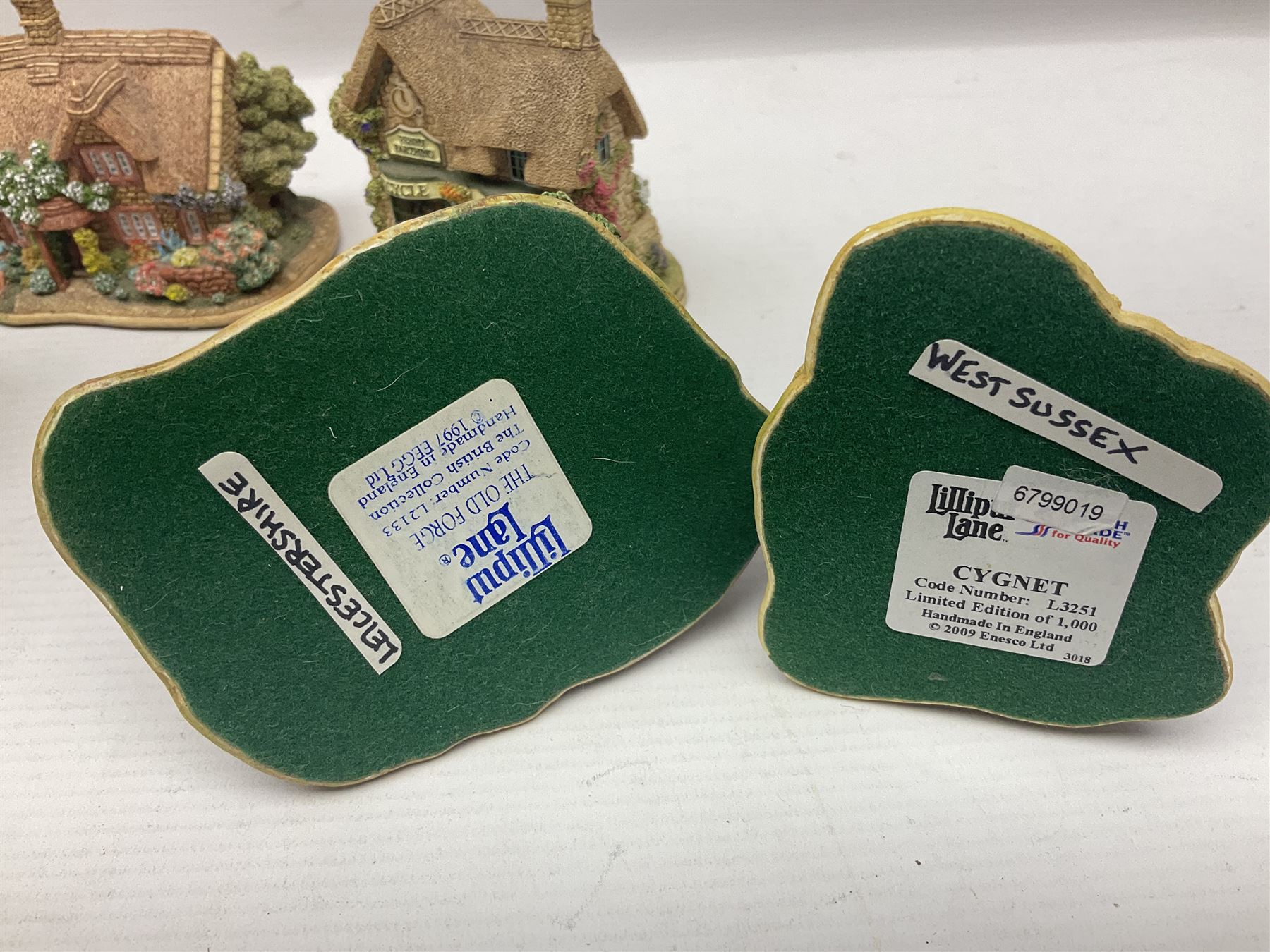 Eighteen Lilliput Lanes, including The Penny Farthing, The Pigsty, Borrowdale School, Fairy Cake Tearoom, An Apple a Day,Ladybird Cottage etc, all with original boxes 