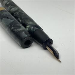 Four fountain pens, each with 14ct gold nibs, comprising Mentmore Paramount, Parker Junior Duofold, Conway Stewart marbleised pen and Waterman's, together with a 14ct gold Conway Stewart 5B nib