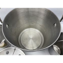 Stainless steel Laurent-Perrier champagne bucket, with engraved brass plaque and grip to swing handle, together with three matching smaller, largest D38cm (4)