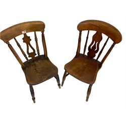Near pair of Victorian elm and beech farmhouse kitchen chairs, pierced splat over shaped saddle seat, on ring turned supports