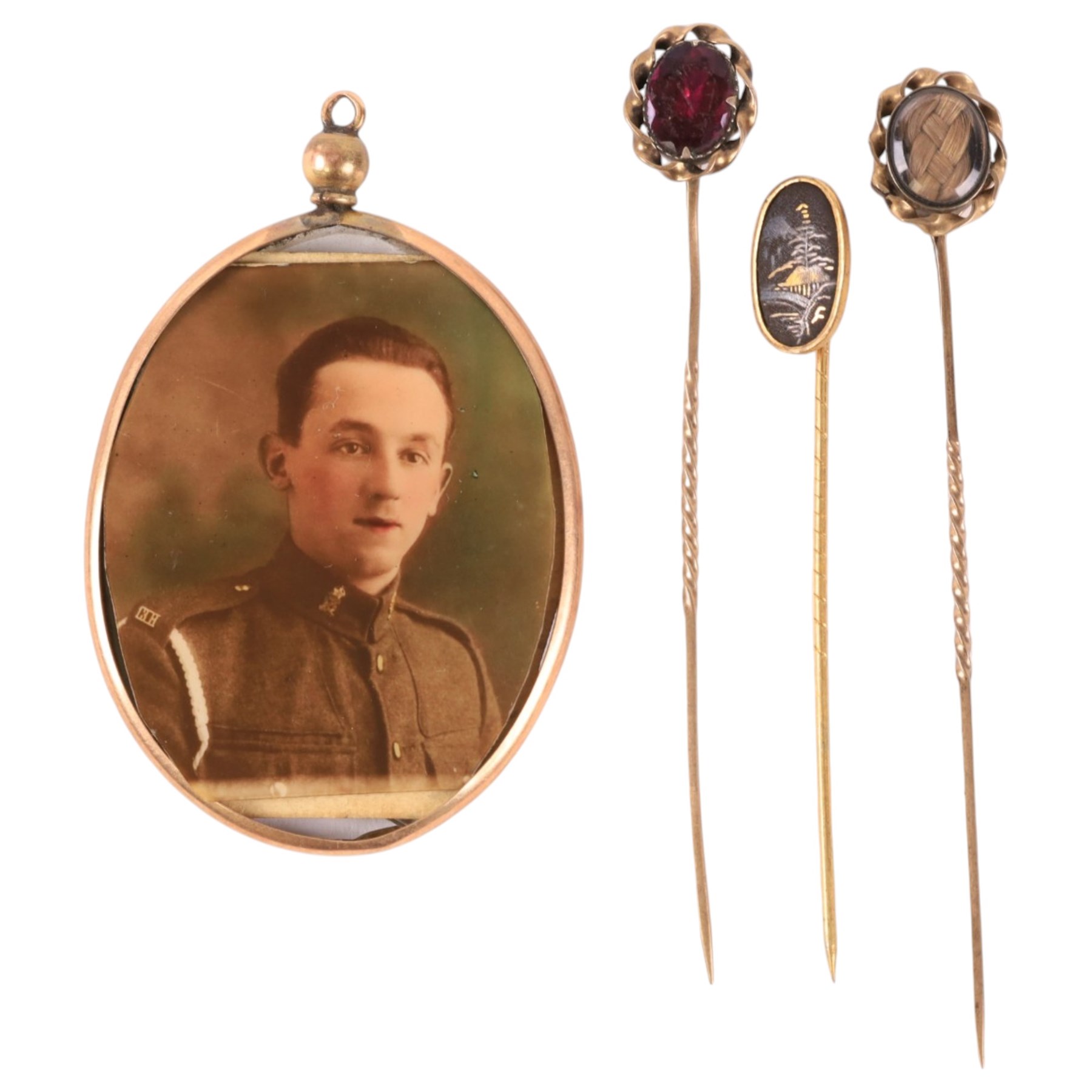 9ct gold photo pendant and three gold plated stick pins, including one stone set and one hairwork example