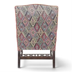 Chippendale design Gainsborough elbow chair, upholstered in kilim fabric, blind fretwork and acanthus carving