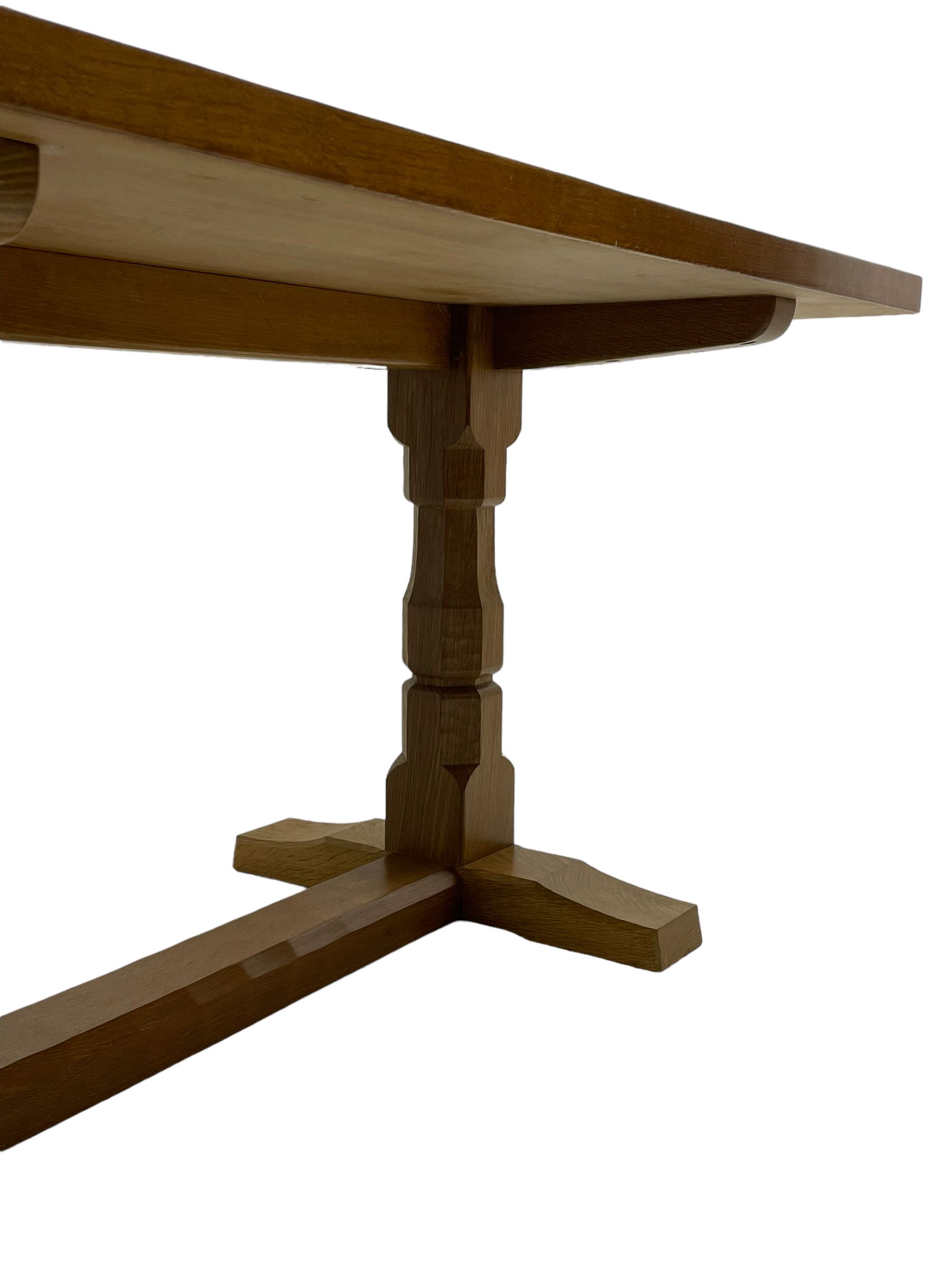 Mouseman - oak dining table, adzed rectangular top on twin octagonal pillar supports, sledge feet united by floor stretcher, by the workshop of Robert Thompson, Kilburn 