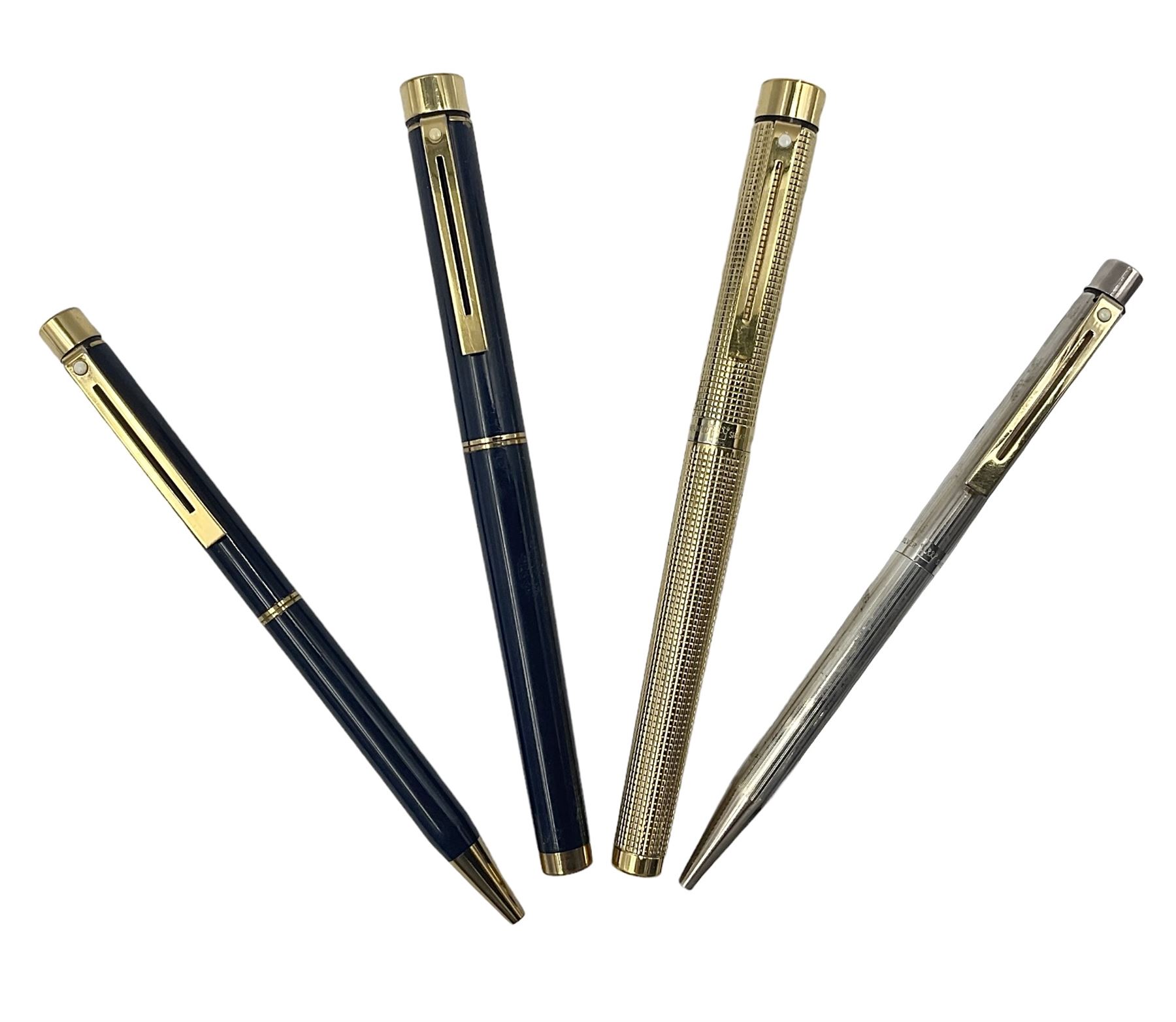Sheaffer Targa 1011 Diamond Square fountain pen, the gold plated barrel with nib stamped 14K 585, together with another Sheaffer Targa fountain pen with blue barrel and gold nib stamped 14K 585 and matching ballpoint, and Sheaffer ballpoint pen with sterling silver barrel, largest L13.5cm (4)
