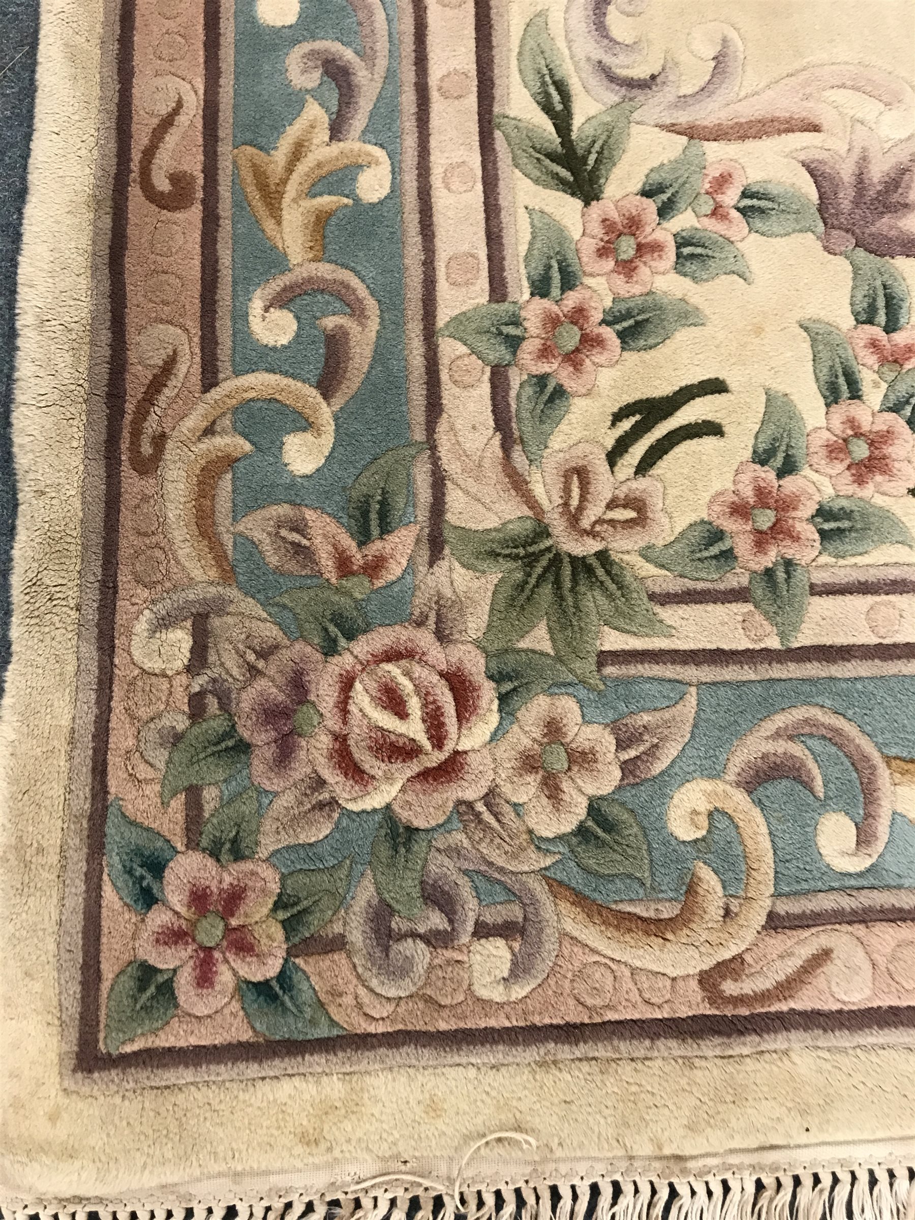 Chinese style beige ground rug, central medallion, repeating border