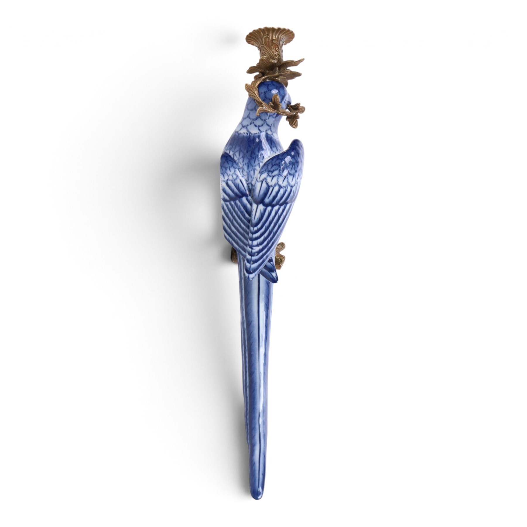 Pair of wall sconces, modelled as blue parrot upon a gilt branch, H47cm