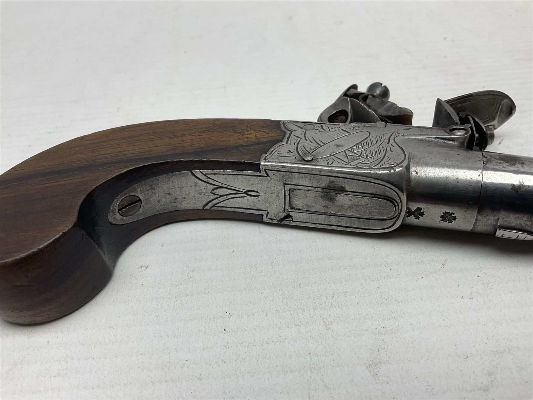 Early 19th century J. Calvert (Leeds) flintlock single barrel tap action pocket pistol, approximately .45 cal., the 4cm (originally) screw off barrel with top safety and walnut stock L16cm overall