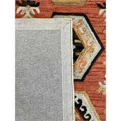 OKA - Turkish design peach ground rug, the field decorated ejder motifs within hooked and geometric design borders 