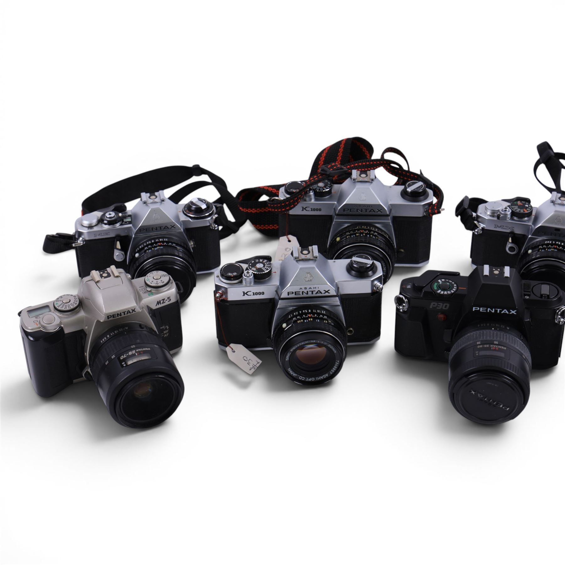 Nine Pentax cameras, including MX, MZ-5, ME Super, P30, etc all with lenses