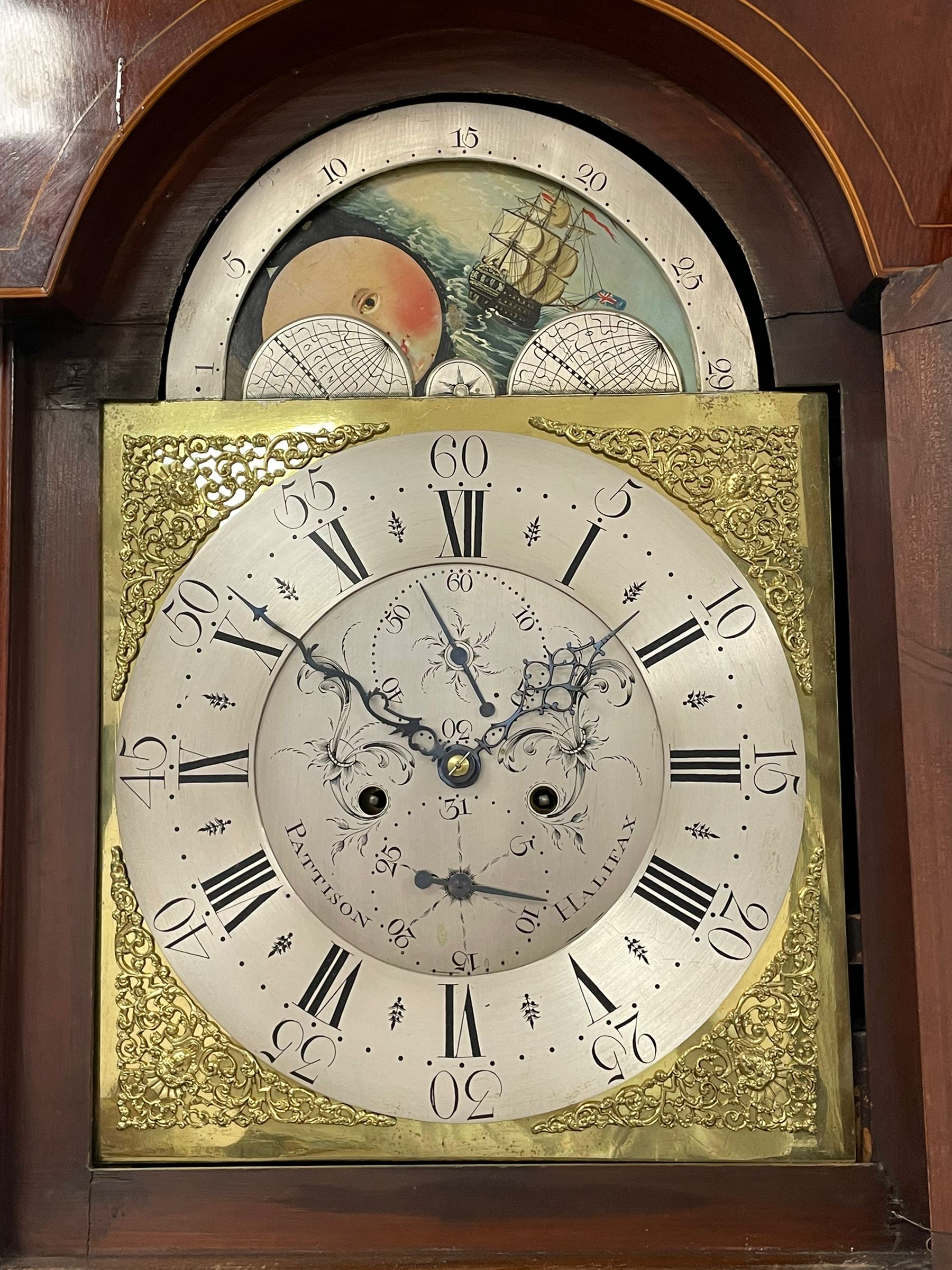Pattison of Halifax - Late 18th century mahogany 8-day longcase clock, With a swans necked pediment and brass patera, recessed break arch hood door beneath flanked by plain turned pilasters with brass capitals, trunk with satinwood inlay, reeded columns and a curved top door with an ivory escutcheon, conforming plinth raised on bracket feet, brass dial with a rolling moon to the arch, cast spandrels , engraved and silvered dial centre  and chapter ring, chapter with Roman numerals, five minute Arabic's and minute markers, makers name to the dial centre with seconds and date work, dial pinned to a rack striking movement, striking the hours on a cast bell. With weights and pendulum. John Pattison is recorded as working in Halifax c1783.   

This item has been registered for sale under Section 10 of the APHA Ivory Act