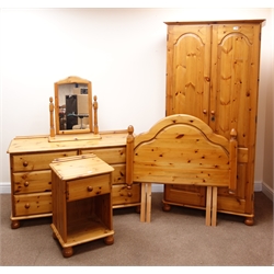  Solid pine double wardrobe,, projecting cornice, two doors, turned supports (W93cm, H191cm, D57cm) a matching six chest, six drawers, turned supports (W129cm, H77cm, D46cm) with dressing mirror, a bedside chest, single drawer and single headboard (5)  