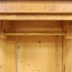 Indigo Furniture - rustic oak triple wardrobe, fitted with three doors with wrought metal fittings and locks, on style supports