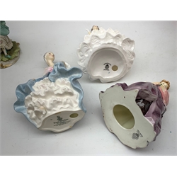 A group of figurines, comprising two boxed Spode Pauline Shine examples, Lily and Olivia (one a/f), a Royal Douton figurine First Dance modelled by F G Doughty, a further Royal Doulton figurine, Debutante, a Royal Doulton figurine, Southern Belle HN2425, and an unmarked continental figurine. 