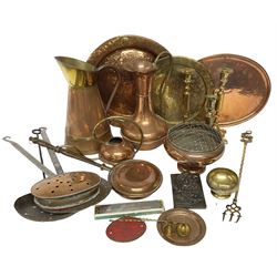 Collection of brass and copper, to include two copper jugs, brass candlesticks, bedwarmers etc 