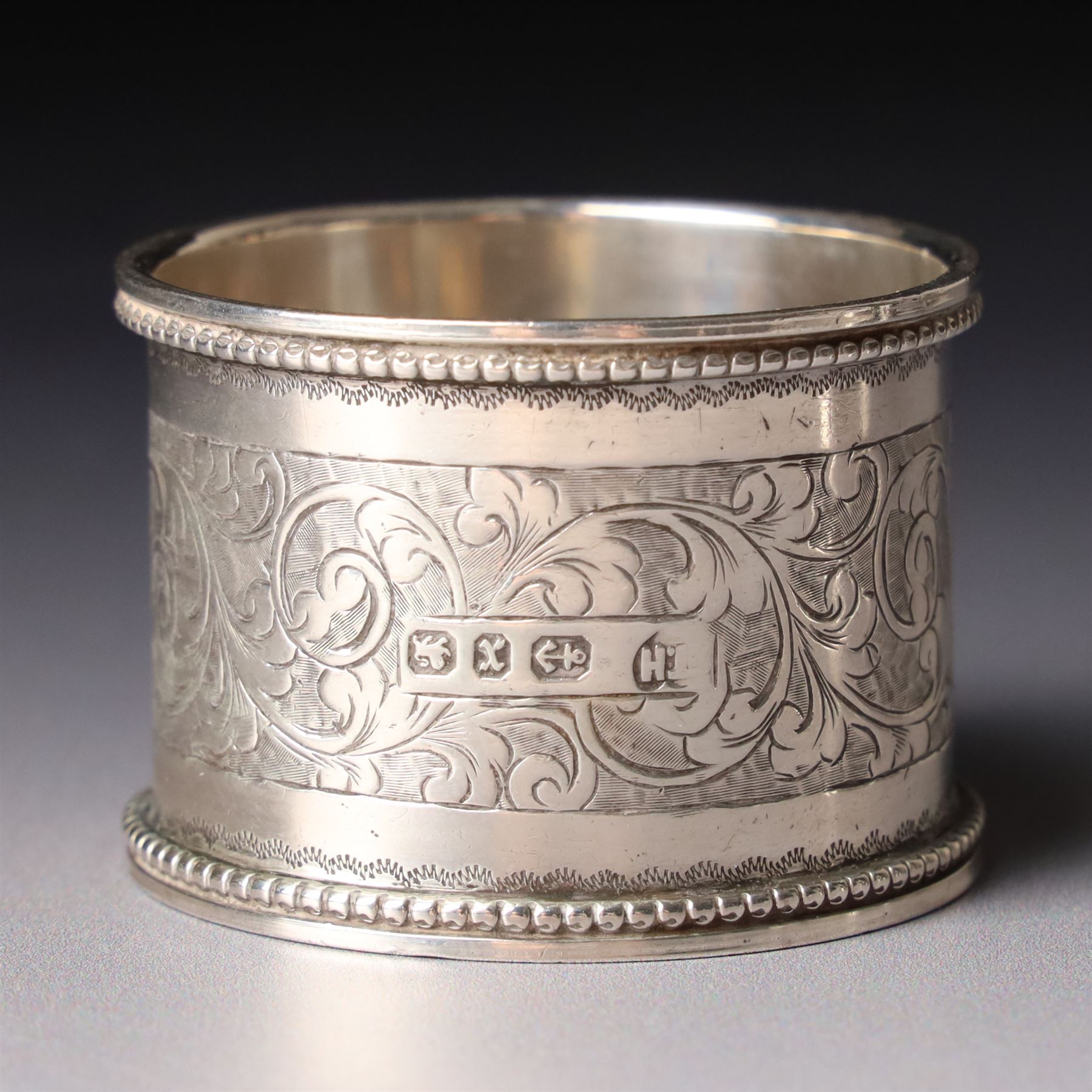 Pair of late Victorian silver napkin rings with engraved decoration Birmingham 1899 and seven other silver napkin rings