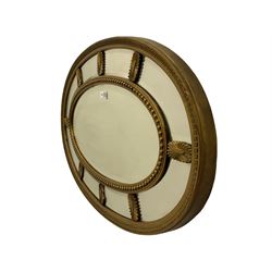 19th/20th century oval gilt framed mirror, set with bevel plate panes, foliate moulded outer band and bead moulded inner band, with Adam style cartouche mounts