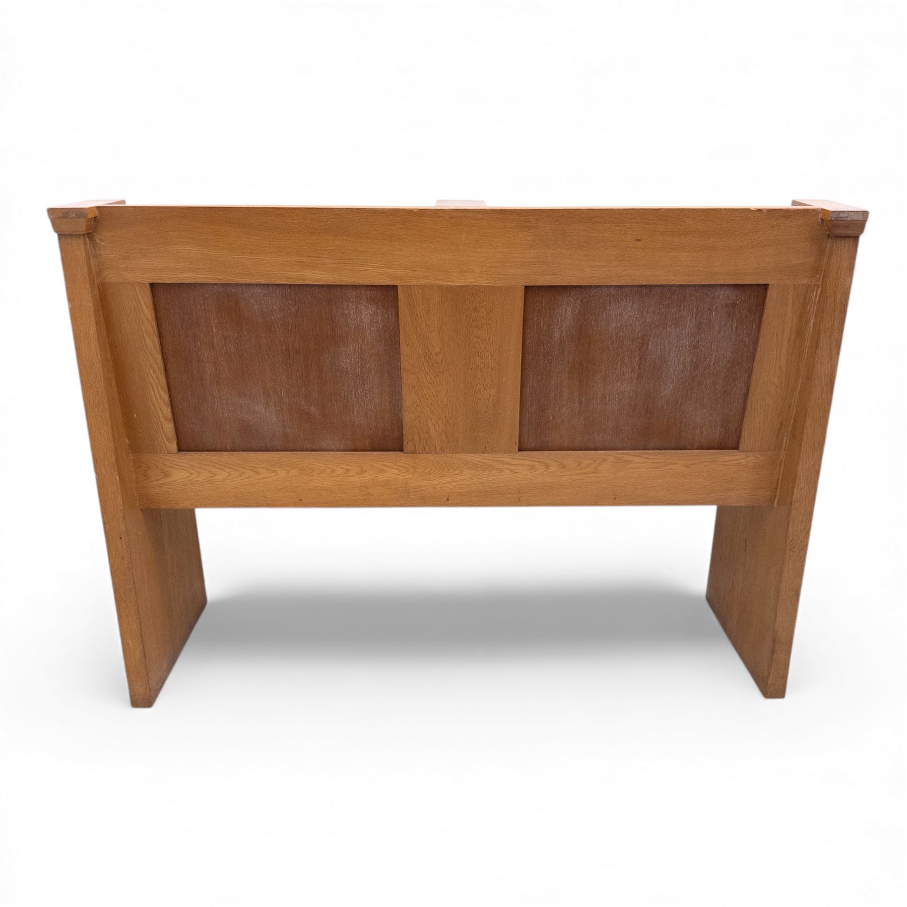 Pair of mid 20th century oak ecclesiastical pews, each with panelled backrests and shaped end supports, of solid construction and mellow honeyed tone
