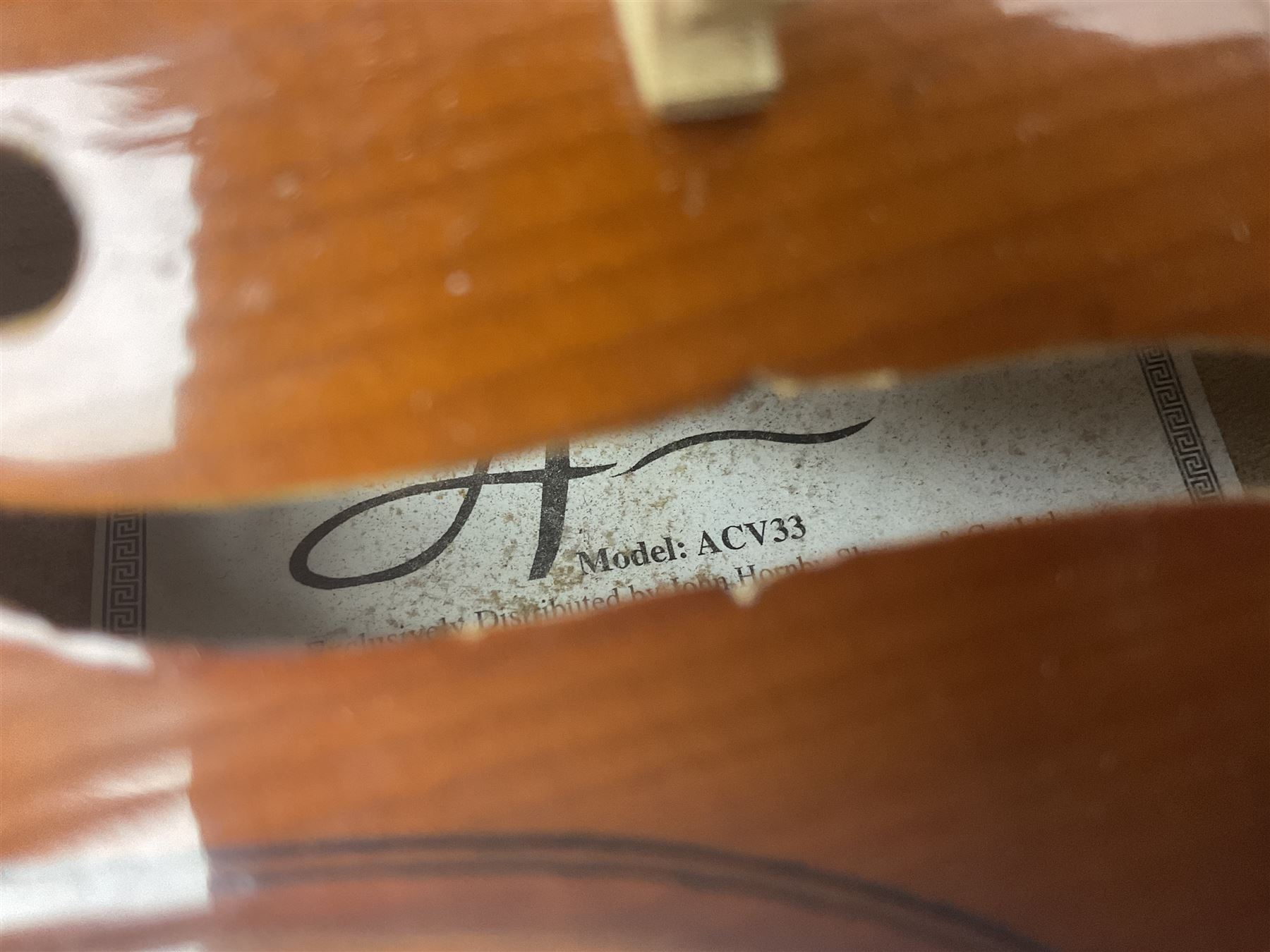 Four Chinese graduated violins - full size with 35.5cm two-piece back; three-quarter size with 33.5cm two-piece back; half size with 31cm two-piece back; and quarter size with 27.5cm two-piece back; all cased except full size; one with bow (4)