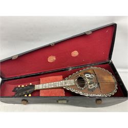 Early 20th Century Neapolitan eight-string lute back mandolin , bearing label for Pietro Antonelli E Figlo, with mother-of-pearl panelled finger board, butterfly decoration to soundhole and fluted back L61cm; in carrying case
