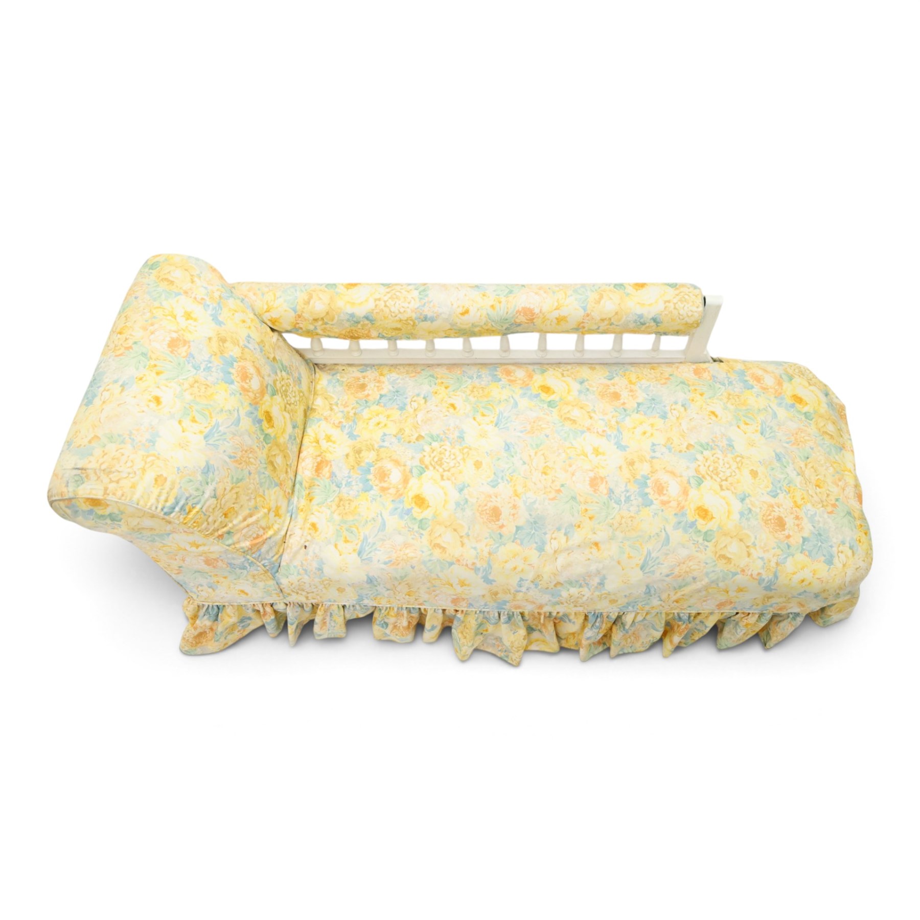 Victorian chaise longue in chintz upholstery, scrolled back with turned spindles up, raised on castors