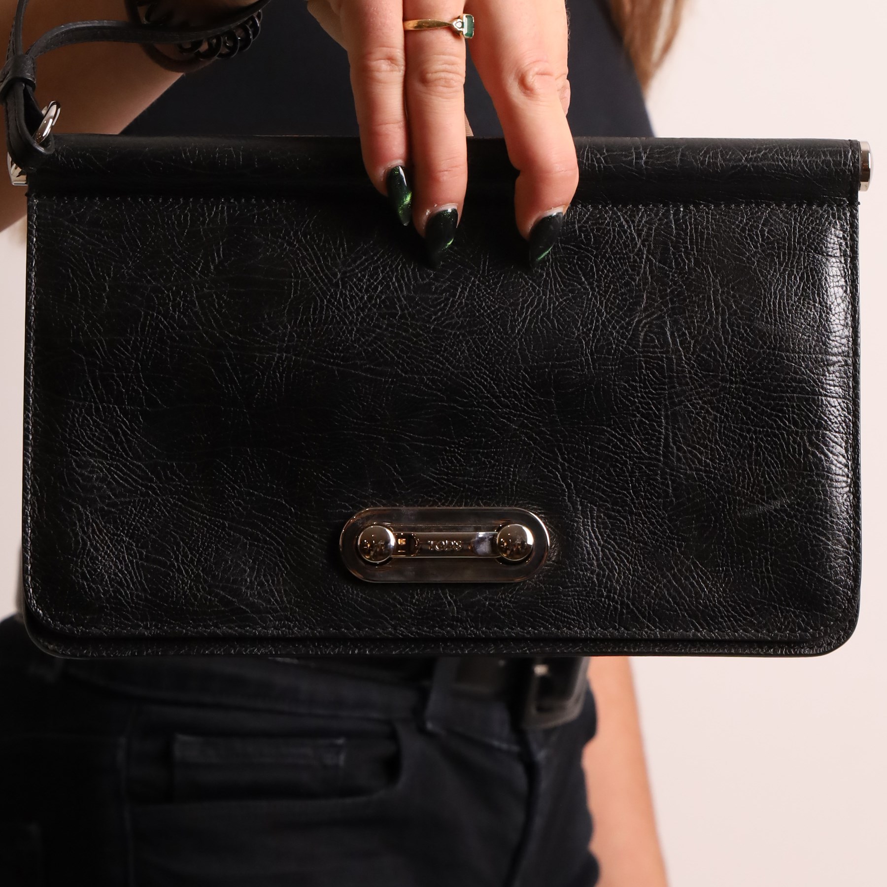 Tod’s - Fashion Pochette Piccola in Nero crinkled patent leather, the rectangular body with rolled-bar top, detachable wrist strap, flap front and silver-tone branded toggle fastening, with original product tag and dust bag