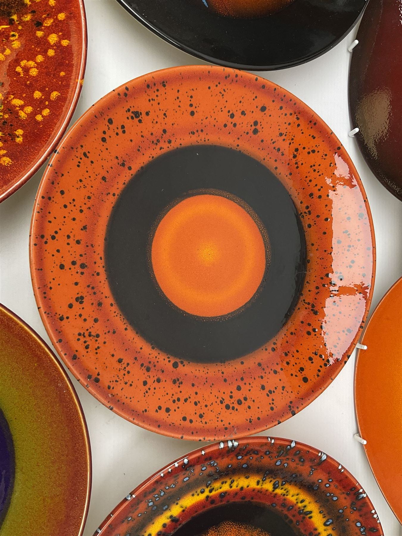 Poole Pottery The Planets, set of nine chargers 'The Planets, by Alan Clarke, comprising Mars, Mercury, Neptune, Venus, Uranus, Pluto, Jupiter, Saturn and Earth, all with original boxes and certificate, D27cm 