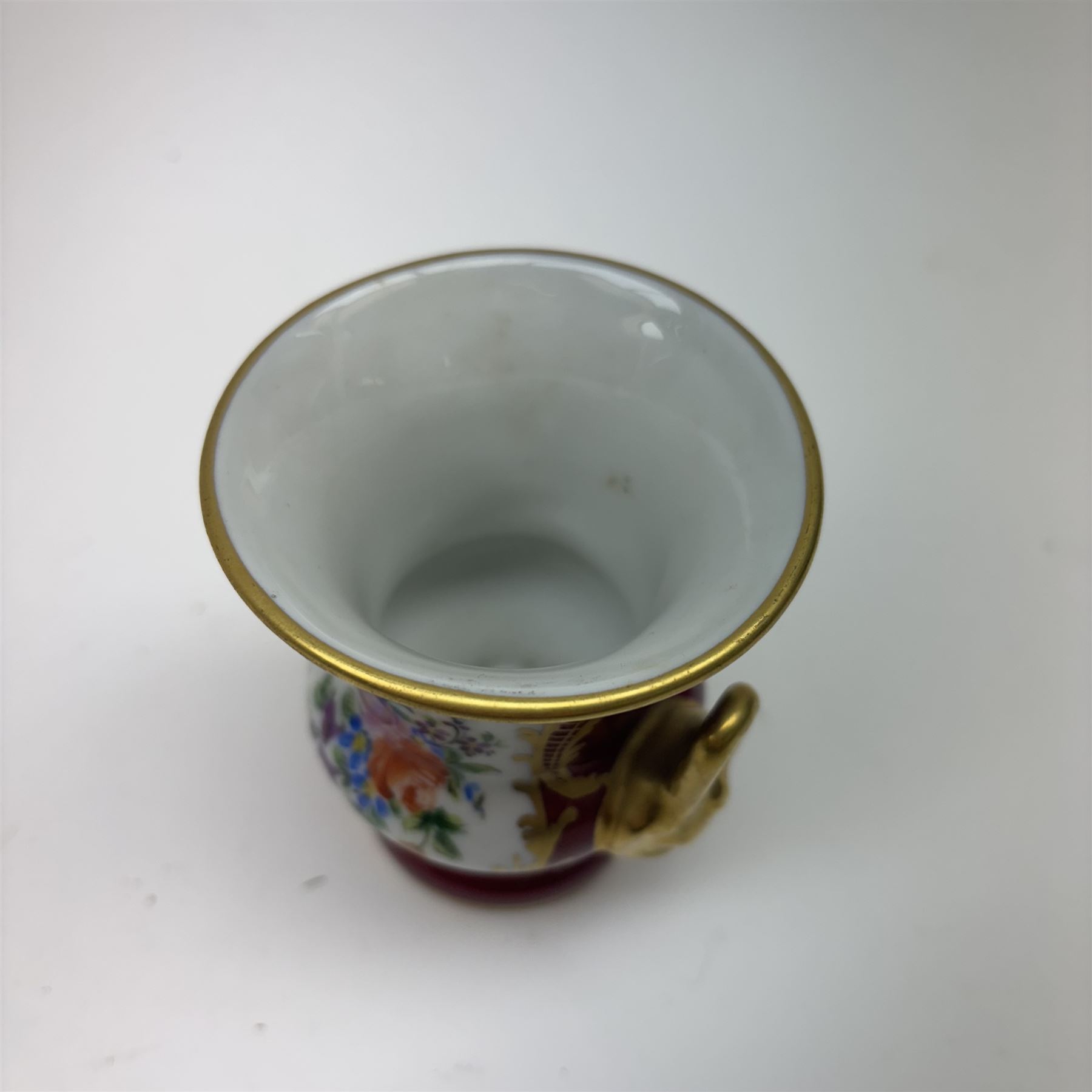 Limoges hand painted vase of baluster form with fluted rim, decorated with birds amongst flowering foliage, together with Camille Le Tallect twin handle vase and two others 