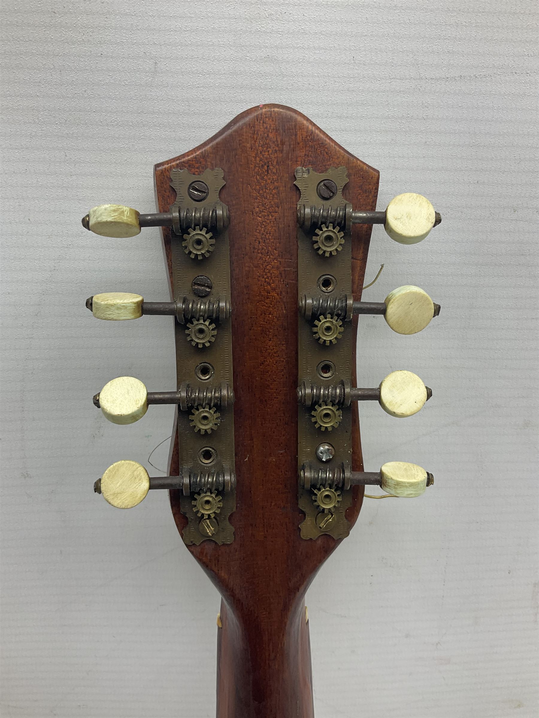 W.D. Keech banjolele pat.219720/23 with etched signature to the back; serial no.A12082 L55cm; and a restored Italian mandolin with segmented lute back; together with three music books