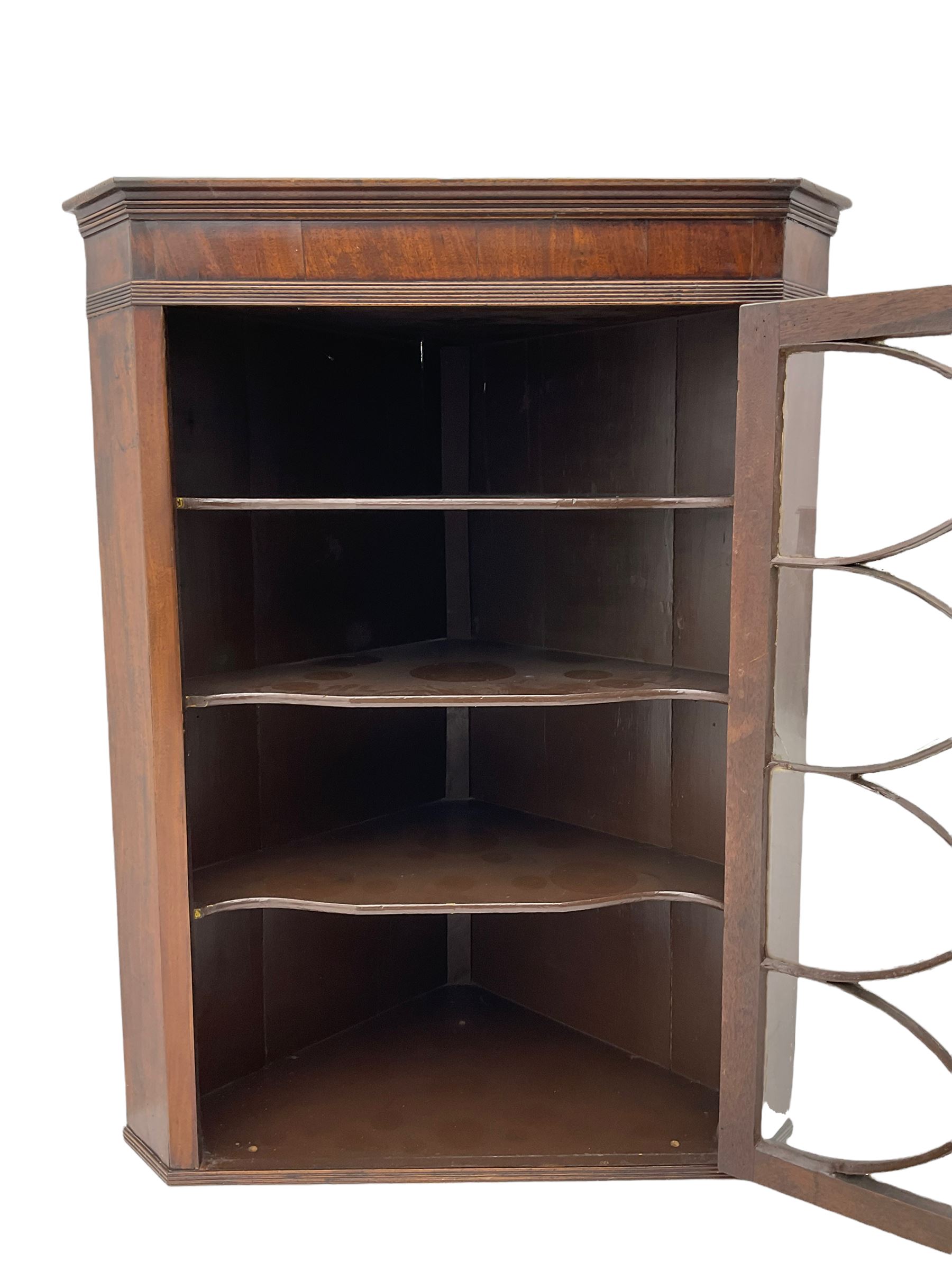 Georgian mahogany wall hanging corner cabinet, enclosed by single door with curved interlacing astragal glazing 