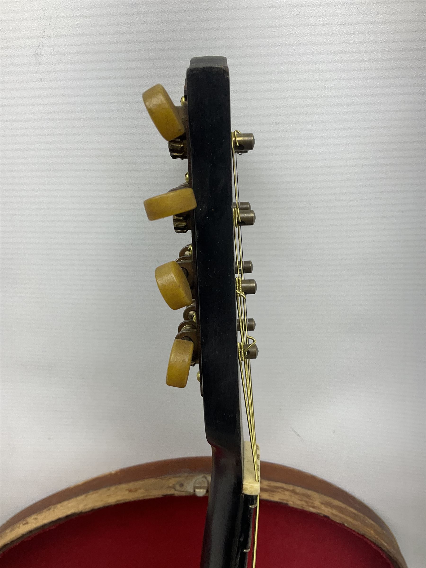 Early 20th century Italian Rafaele Disantino eight-string mandolin with two-piece back and spruce top with stamped Rafaele Disantino signature; bears maker's label L61cm; in wooden carrying case
