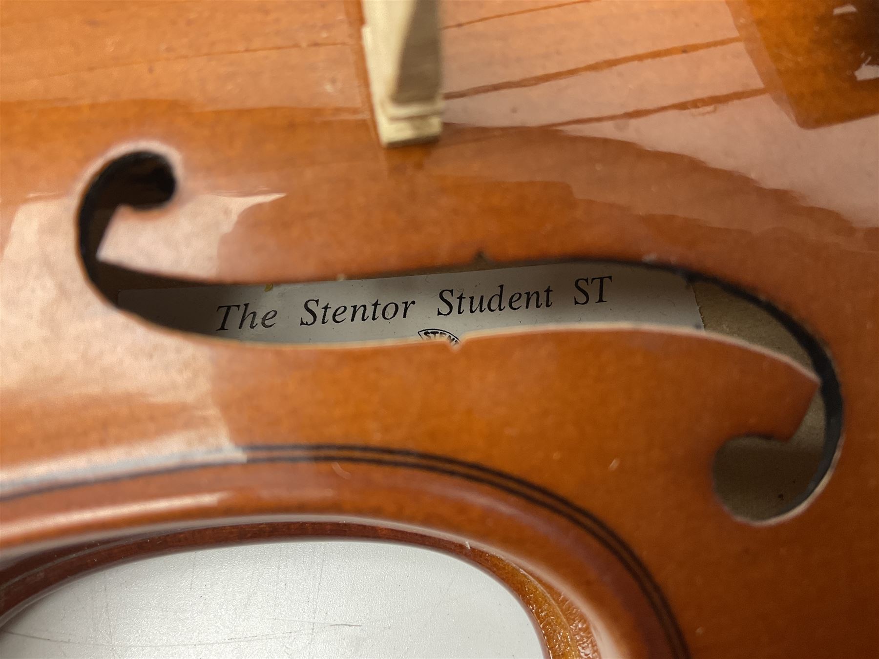 Four student violins - two Chinese three-quarter size with 33.5cm and 34cm two-piece backs; Stringers of Edinburgh quarter size with 28cm two-piece back; and Stentor quarter size with 28cm two-piece back; each in carrying case (4)