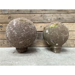 Two spherical stone gate post finials