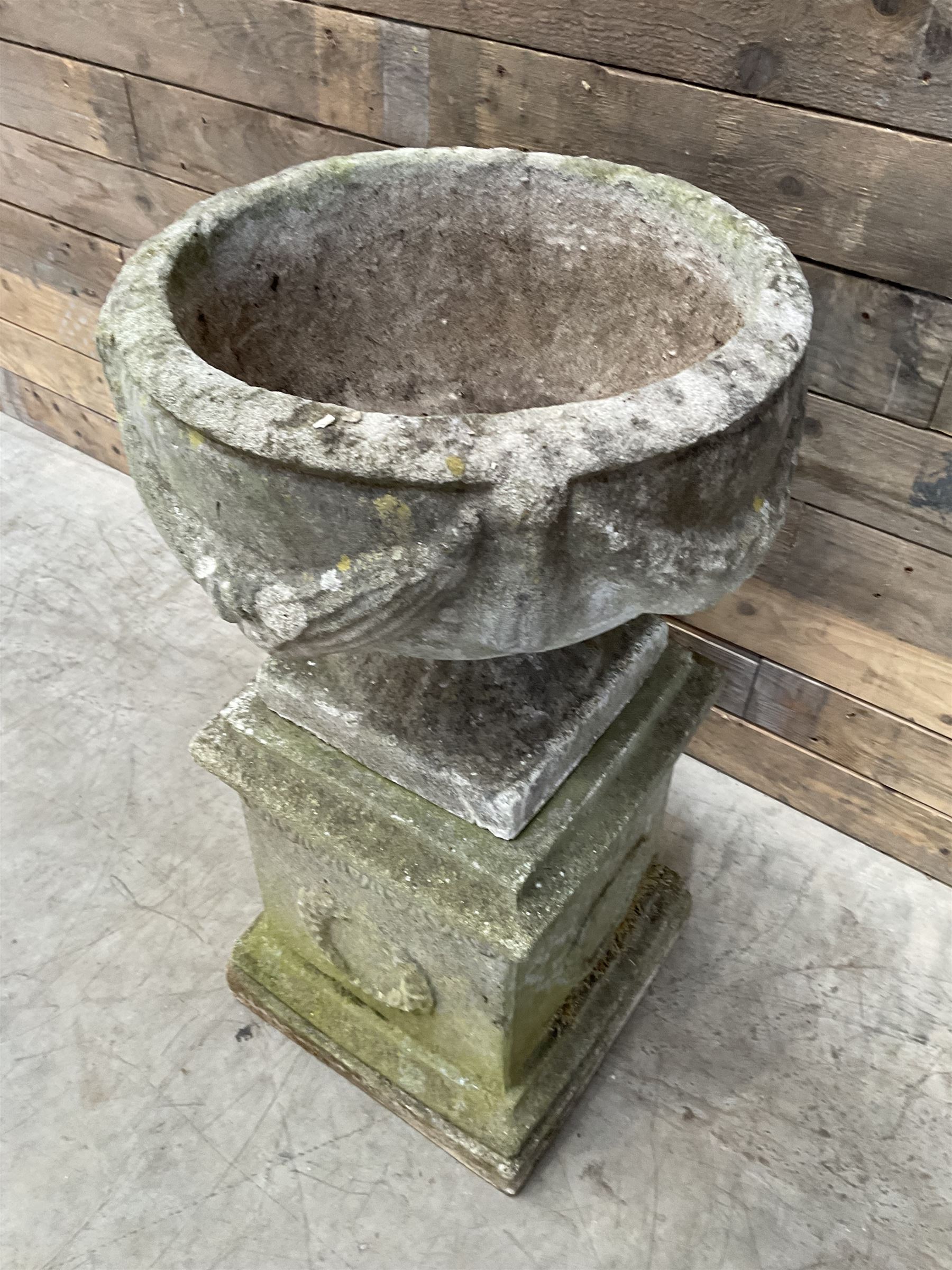 Cast stone centerpiece urn on plinth