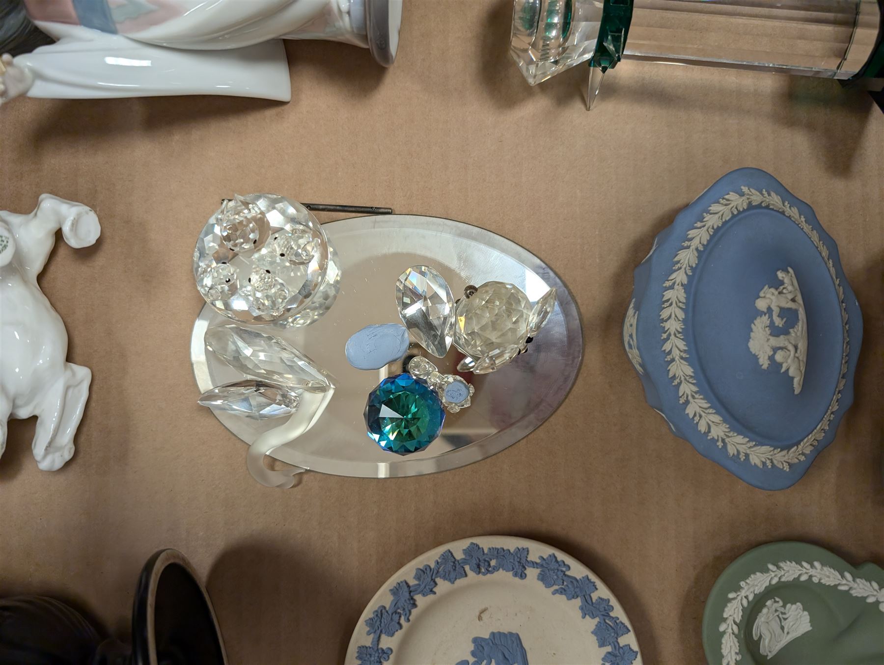 Lladro figure, Royal Doulton dog figure, small Swarovski Crystal figures, Wedgewood urn and four pieces of Wedgewood Jasperware, etc