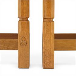 Knightman - eight oak dining chairs, the rectangular back with square section lattice splat enclosed by straight stiles and top rail, drop in upholstered seat in pale patterned fabric, raised on square section legs with chamfered detailing united by stretchers, with carved knight signature, by Horace Knight of Thirsk