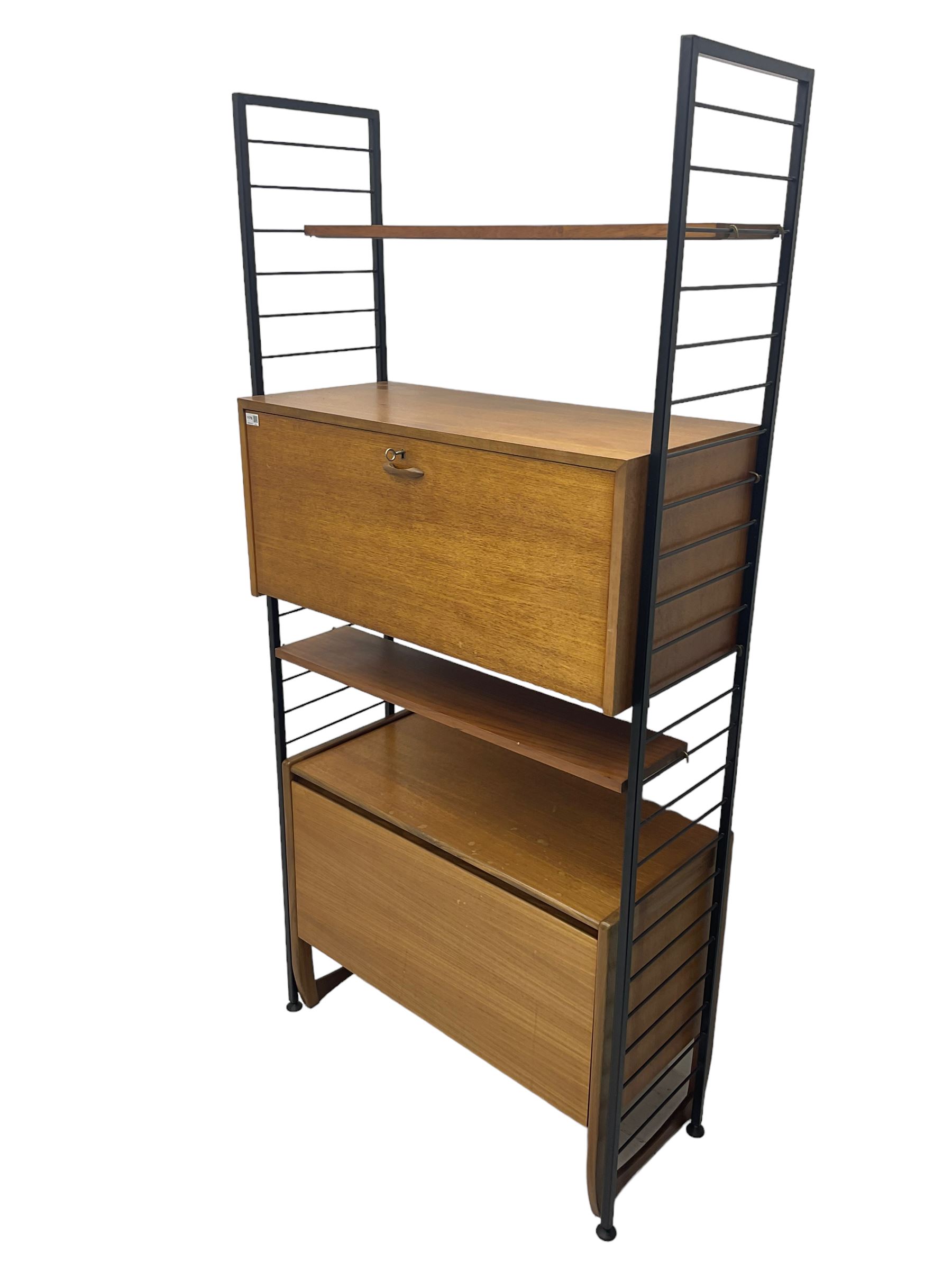 Staples Ladderax - mid-20th century teak and metal framed modular wall unit, fitted with central fall-front cupboard enclosing correspondence dividers, over secondary separate teak fall-front cupboard, adjustable shelf to top