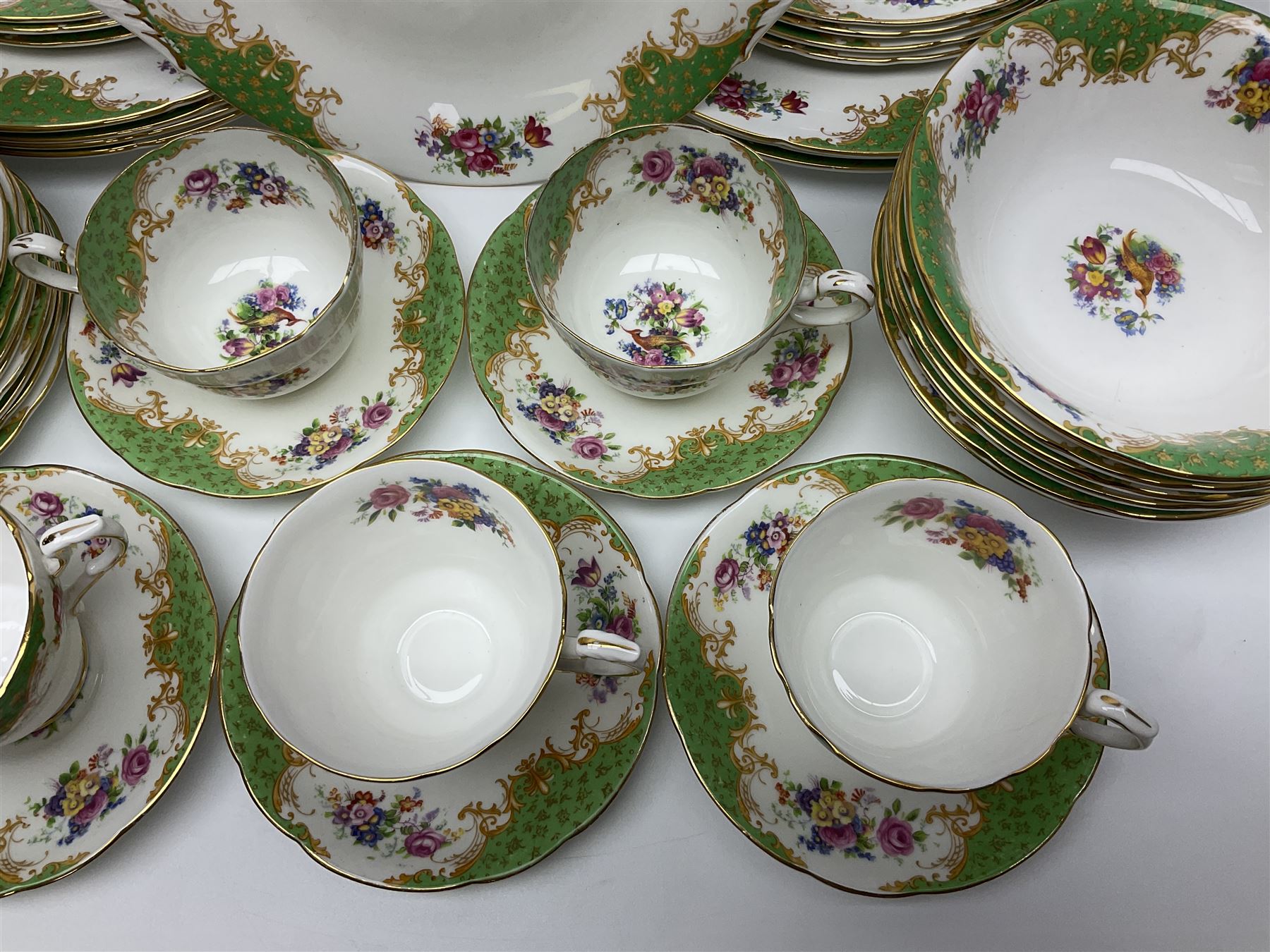 Paragon Rockingham pattern part tea and dinner service including eight cup and saucers of various sizes, eight dessert plates, eight dinner plates, etc (48)