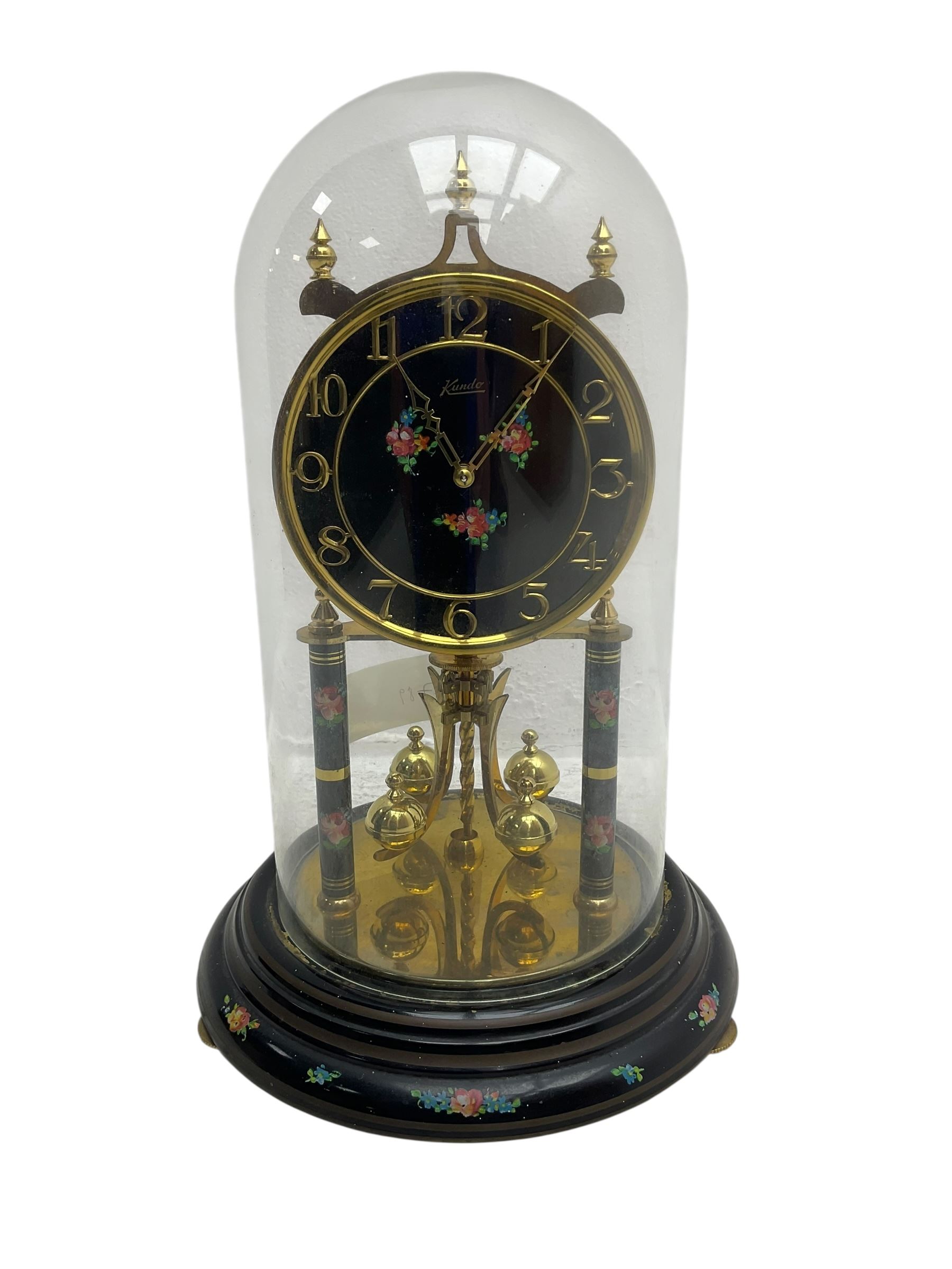 Kundo 1960’s torsion clock with a skeleton movement and four ball oscillating pendulum, with a glass dome. Torsion spring intact.