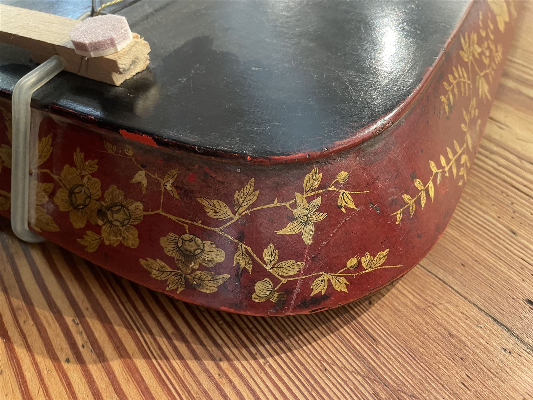 Early 19th century red lacquered papier-mâché tray by Clay of King Street Covent Garden, of rounded rectangular form, painted in gilt with large foliate sprays and butterflies, impressed verso CLAY KING ST COVENT GARDEN, W66.5cm D48.5cm