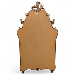 Rococo design carved gilt wood wall mirror, shaped and moulded frame decorated with scrolling leafage, plain mirror plate divided by mouldings