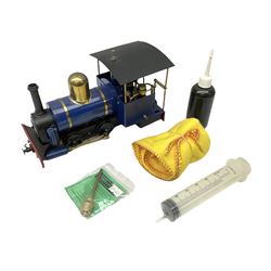 '0' gauge - live steam 0-4-0 locomotive in blue and black with brass fittings, no maker's name, with steam oil and syringe; unboxed
