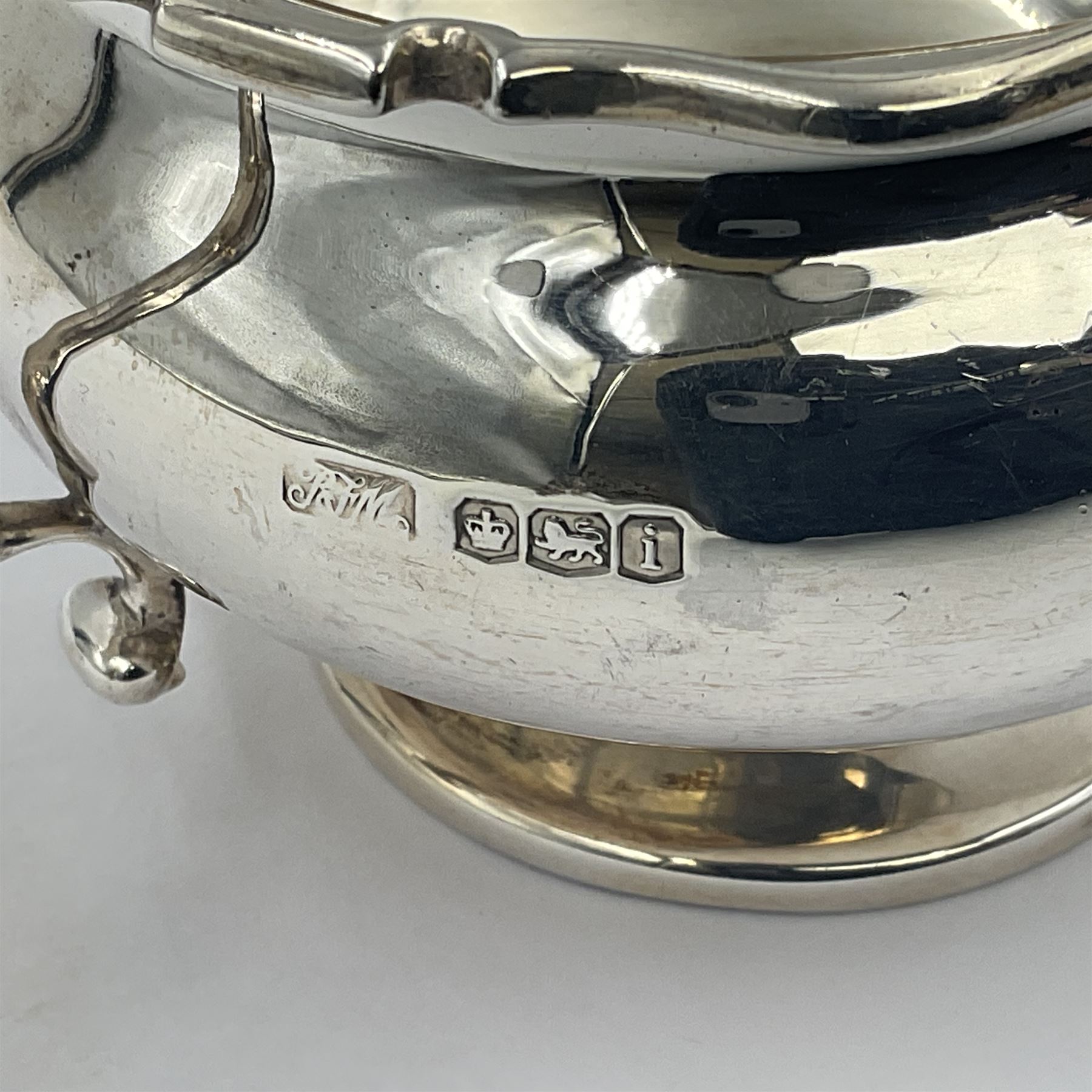 1920s five-piece silver tea service, comprising teapot, coffee pot, hot water pot, twin handled open sucrier and milk jug, each of squat circular form with shaped rim, the teapot, coffee pot and hot water pot each with ebonised handle and finial, the sucrier and milk jug with acanthus capped scroll handles, all upon circular foot, hallmarked R F Mosley & Co, Sheffield 1926 & 1927, tallest H24cm