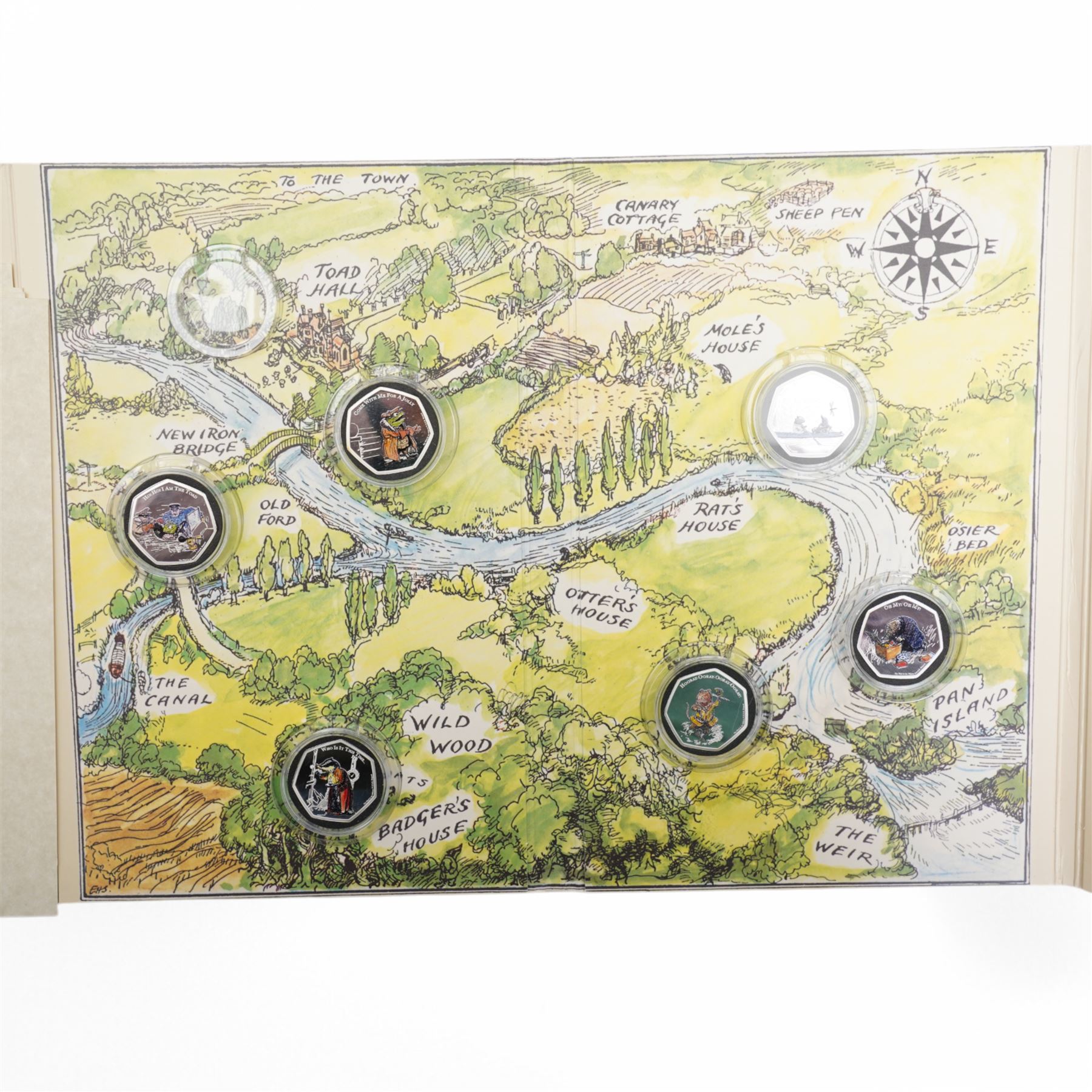 Two part coin sets 2021 'The Wind in the Willows' produced for the Bradford Exchange, one comprising six 'Fine .999 Silver' Ascension Island fifty pence coins, the second comprising six 'Layered in Pure Silver' Ascension Island fifty pence coins, both with certificates