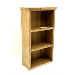Small wall mounted pine bookcase, fitted with two fixed shelves 