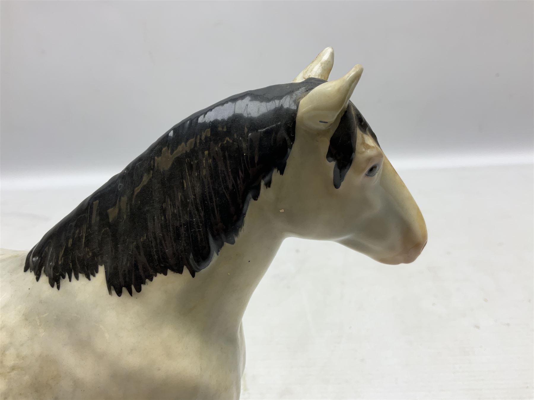 Group of three Beswick Shire horses, comprising CH. Burnham Beauty mare in matte finish, dapple grey horse and bay horse, all with stamped marks beneath