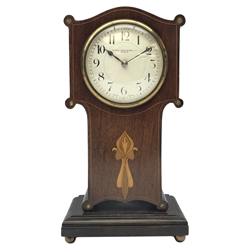  Art Nouveau inlaid mahogany serpentine top mantel timepiece, the  convex white enamel Arabic dial signed Manoah Rhodes & Sons. Ltd. Bradford, with brass bezel and key wind movement, on plinth base with brass ball feet, H26cm  