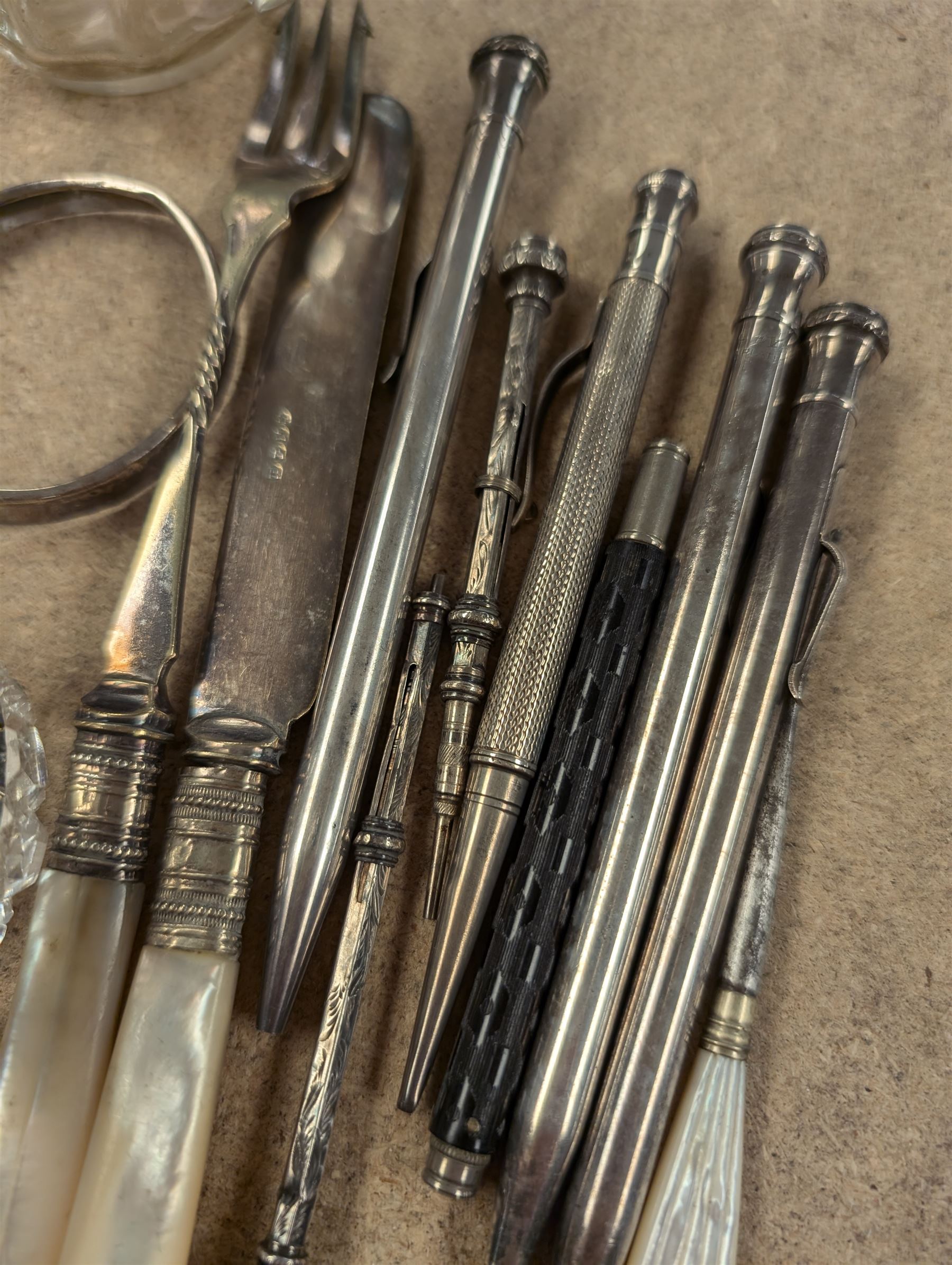 Silver propelling pencil and a silver toothpick, together with two silver collared glass items and a small collection of silver plated propelling pencils, etc