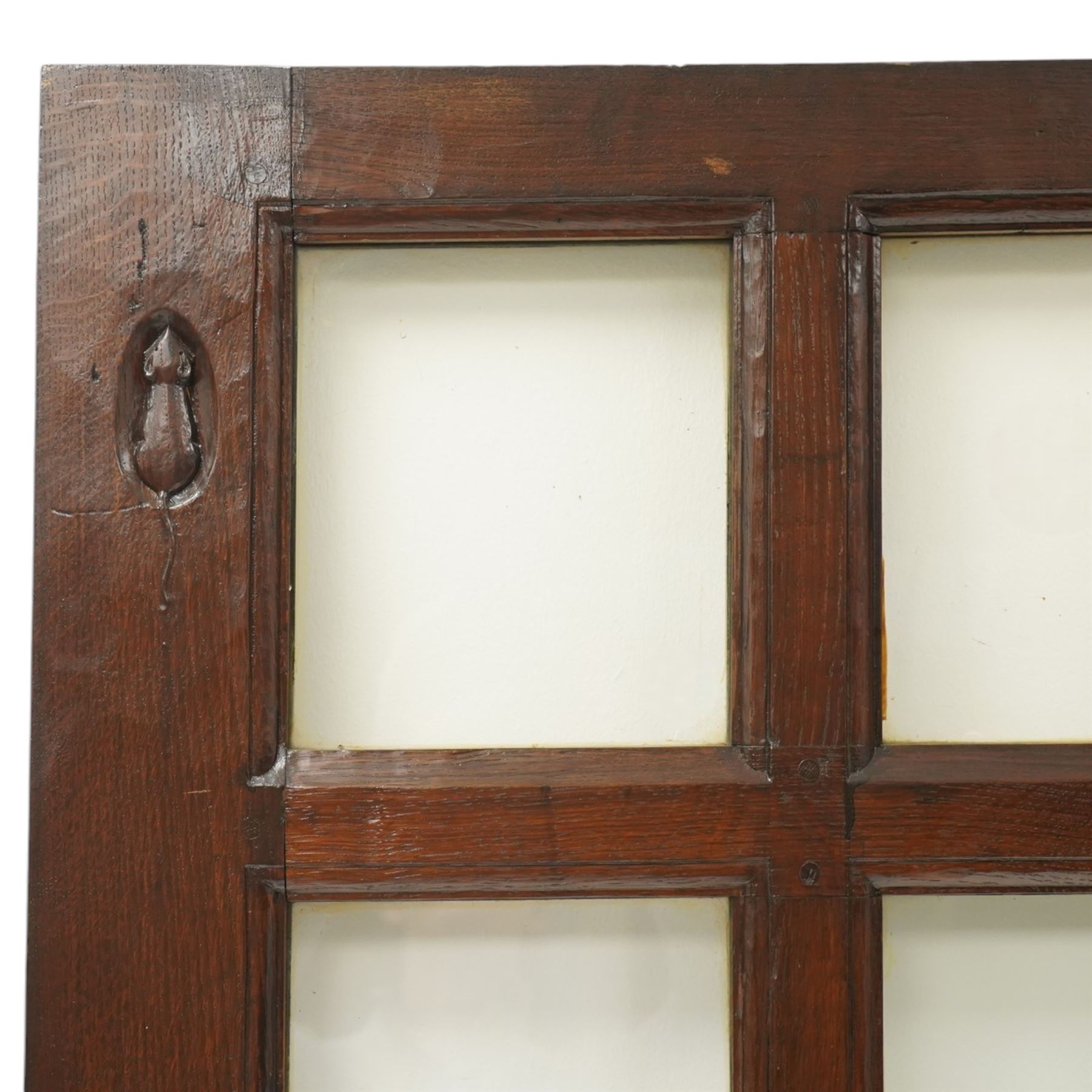 Mouseman - 1940s glazed, panelled and adzed vestibule door with castellated frame, with carved mouse signature, by Robert Thompson of Kilburn