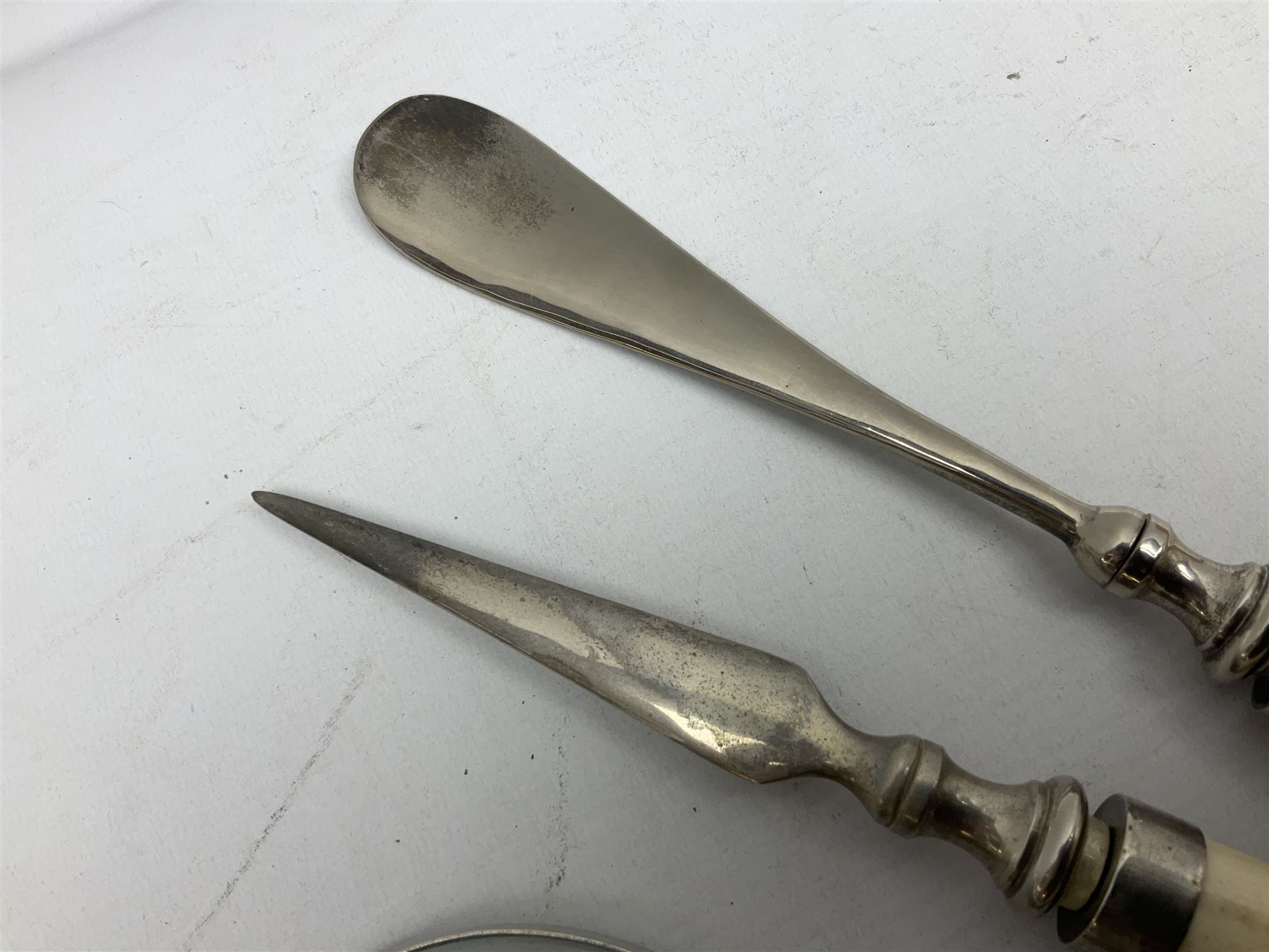 Magnifying glass, letter opener and shoe horn set, with bone handles and silver plated finials 