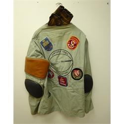  Lightweight shooting jacket, padded right shoulder and elbows, with Vintage Rifle Association decal and various shooting related patches, and a fingerless leather shooting glove (2)  